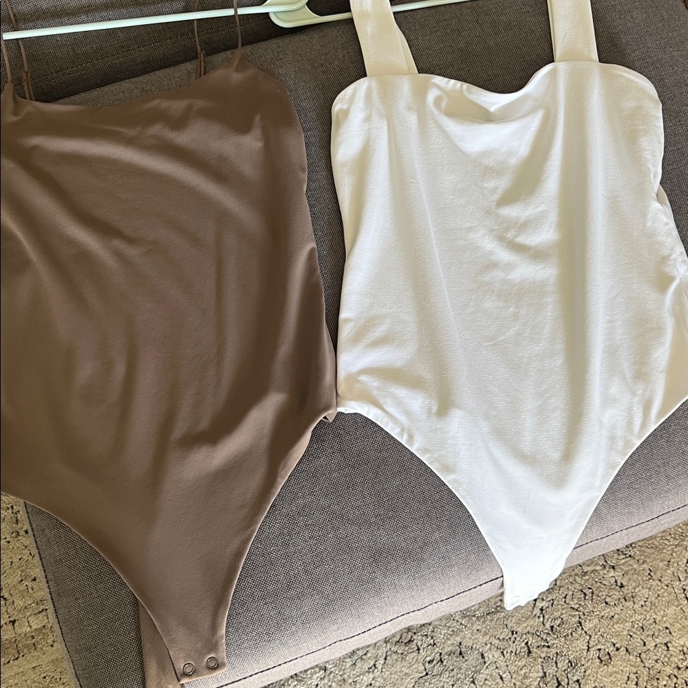 THREE Nuuds Bodysuits, white brown and taupe
